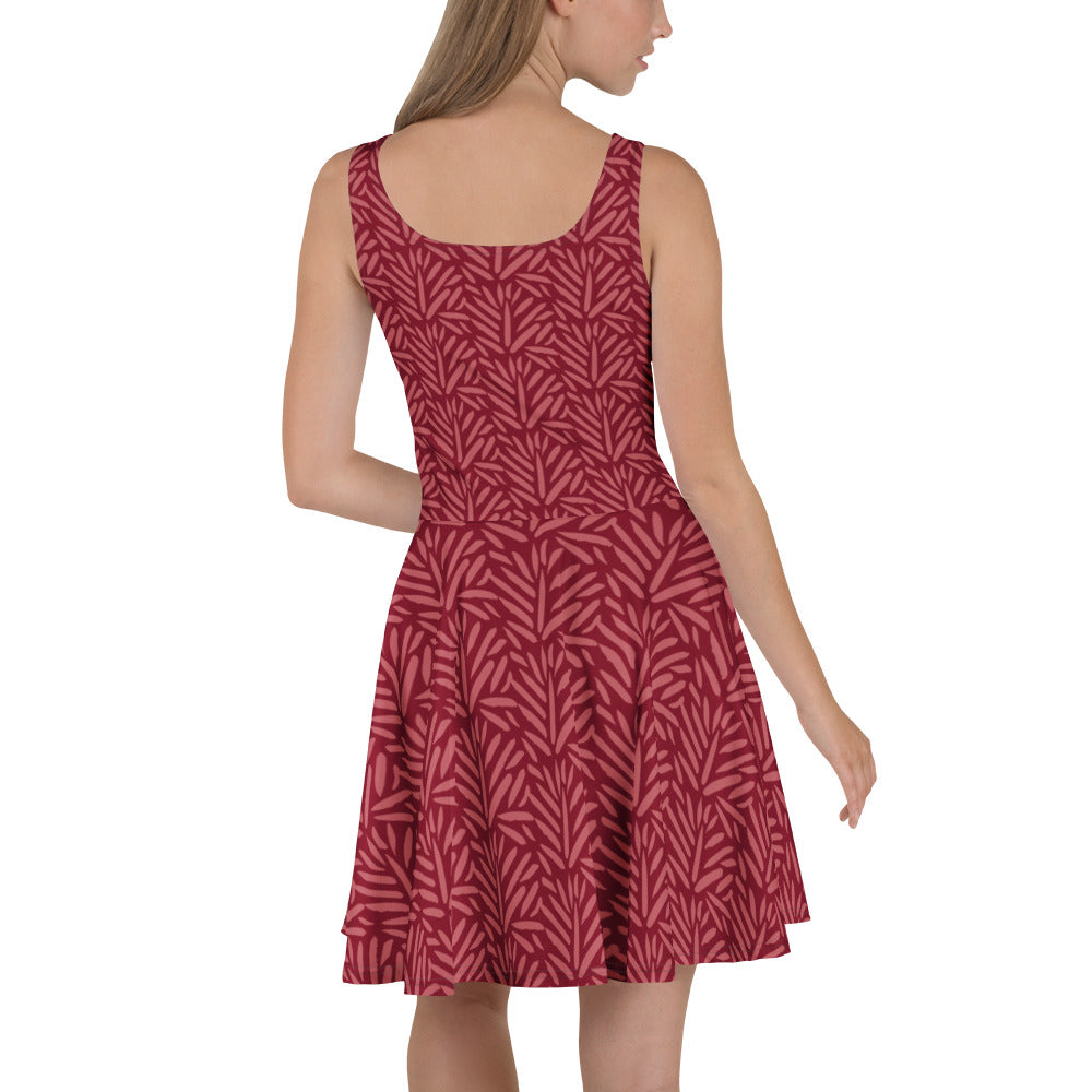 Achterkant van een model die de Measterwerk dames skaterjurk met all-over bloemenprint rood draagt.