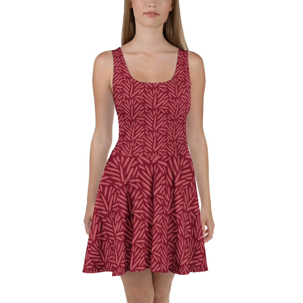 Sfeerfoto van een model in de Measterwerk dames skaterjurk met een all over bloemenprint rood, vooraanzicht.