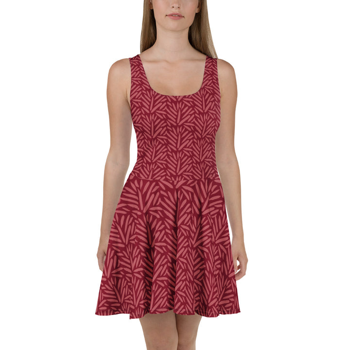 Sfeerfoto van een model in de Measterwerk dames skaterjurk met een all over bloemenprint rood, vooraanzicht.