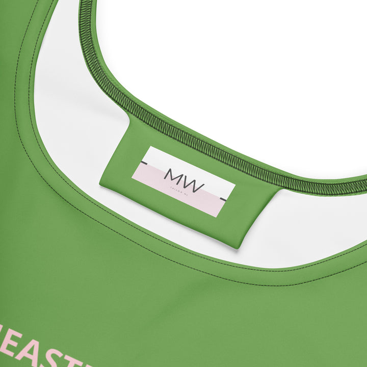 Close-up van het Measterwerk kledinglabel en de hoogwaardige groene stof van de dames skaterjurk.